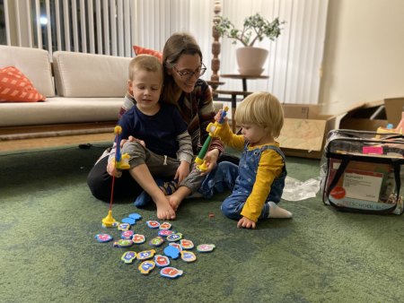 Family plays fishing game