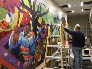 Robert Jessup installs his library mural, January 2016