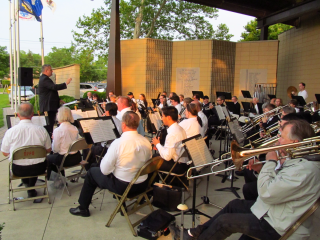 Al Legutki conducts the Des Plaines Community Concert Band in a performance at the band shell by Lake Opeka. The band shell is dedicated to veterans from Des Plaines. Since we moved to Des Plaines in 1992 I've played dozens of concerts at the shell with the band.