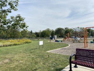 StoryWalk signs along the playground and walking path in Blackhawk Park. 