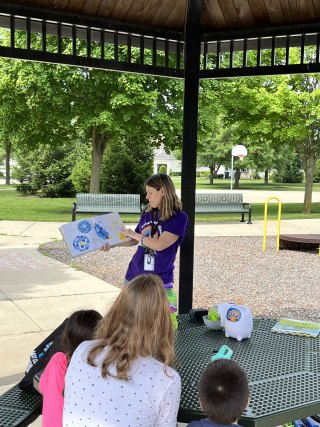 Miss Stephanie reading The Perfect Fit by Naomi Jones and James Jones