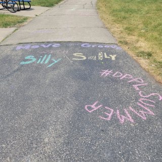 Sidewalk chalk on blacktop 