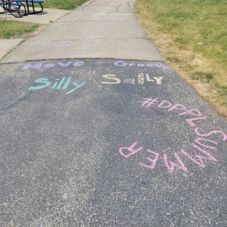 Sidewalk chalk on blacktop 