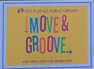 A yellow sign with the words move and groove in different colors