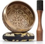 gold colored singing bowl with mallet