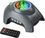 black device with dome on top, buttons in front, and small remote control
